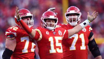 KANSAS CITY, MISSOURI - JANUARY 19: Patrick Mahomes #15 of the Kansas City Chiefs reacts with teammates Eric Fisher #72 and Mitchell Schwartz #71 after a fourth quarter touchdown pass against the Tennessee Titans in the AFC Championship Game at Arrowhead Stadium on January 19, 2020 in Kansas City, Missouri. (Photo by Jamie Squire/Getty Images)