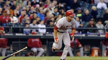 May 29, 2014; Seattle, WA, USA; Los Angeles Angels center fielder Mike Trout (27) runs towards first base after hitting a RBI single against the Seattle Mariners during the sixth inning at Safeco Field. Mandatory Credit: Steven Bisig-USA TODAY Sports