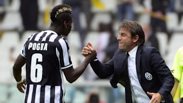 Juventus' French midfielder Paul Labile Pogba (L) celebrates with coach Antonio Conte after scoring during the Serie A football match Torino vs Juventus at the Olimpico stadium on September 29, 2013 in Turin. AFP PHOTO / OLIVIER MORIN (Photo credit should read OLIVIER MORIN/AFP via Getty Images)