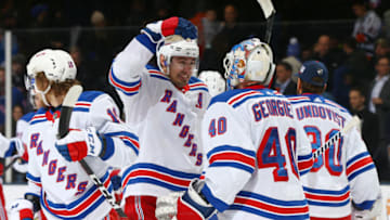 UNIONDALE, NEW YORK - JANUARY 16: Chris Kreider #20 of the New York Rangers celebrates with Alexandar Georgiev #40 after their 3-2 win against the New York Islanders at NYCB Live's Nassau Coliseum on January 16, 2020 in Uniondale, New York. (Photo by Mike Stobe/NHLI via Getty Images)