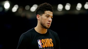 ORLANDO, FLORIDA - DECEMBER 04: Devin Booker #1 of the Phoenix Suns warms up prior to the game against the Orlando Magic at Amway Center on December 04, 2019 in Orlando, Florida. NOTE TO USER: User expressly acknowledges and agrees that, by downloading and/or using this photograph, user is consenting to the terms and conditions of the Getty Images License Agreement. (Photo by Michael Reaves/Getty Images)