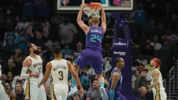 Mar 21, 2022; Charlotte, North Carolina, USA; Charlotte Hornets center Mason Plumlee (24) dunks the ball against the New Orleans Pelicans during the second half at Spectrum Center. Mandatory Credit: Jim Dedmon-USA TODAY Sports