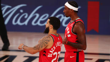 LAKE BUENA VISTA, FLORIDA - AUGUST 05: Rondae Hollis-Jefferson #4 and Fred VanVleet #23 of the Toronto Raptors talk in the first half during a break in the action against the Orlando Magic at Visa Athletic Center at ESPN Wide World Of Sports Complex on August 5, 2020 in Lake Buena Vista, Florida. NOTE TO USER: User expressly acknowledges and agrees that, by downloading and or using this photograph, User is consenting to the terms and conditions of the Getty Images License Agreement. (Photo by Kim Klement-Pool/Getty Images)