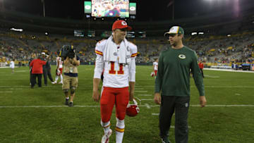 GREEN BAY, WI - AUGUST 28: Alex Smith #11 of the Kansas City Chiefs and Aaron Rodgers #12 of the Green Bay Packers walk off the field after the Packers defeated the Chiefs 34-14 during the preseason game on August 28, 2014 at Lambeau Field in Green Bay, Wisconsin. (Photo by John Konstantaras/Getty Images)