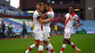 Southampton's English midfielder James Ward-Prowse (L) celebrates with Southampton's English striker Danny Ings (C) and Southampton's English defender Kyle Walker-Peters (R) after scoring their second goal during the English Premier League football match between Aston Villa and Southampton at Villa Park in Birmingham, central England on November 1, 2020. (Photo by Gareth Copley / POOL / AFP) / RESTRICTED TO EDITORIAL USE. No use with unauthorized audio, video, data, fixture lists, club/league logos or 'live' services. Online in-match use limited to 120 images. An additional 40 images may be used in extra time. No video emulation. Social media in-match use limited to 120 images. An additional 40 images may be used in extra time. No use in betting publications, games or single club/league/player publications. / (Photo by GARETH COPLEY/POOL/AFP via Getty Images)