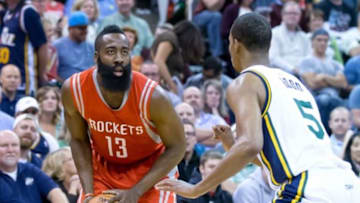 Oct 29, 2014; Salt Lake City, UT, USA; Utah Jazz guard Rodney Hood (5) defends against Houston Rockets guard James Harden (13) during the first half at EnergySolutions Arena. Mandatory Credit: Russ Isabella-USA TODAY Sports