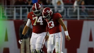TUSCALOOSA, AL - NOVEMBER 10: Tua Tagovailoa #13 of the Alabama Crimson Tide walks off the field with Jedrick Wills Jr. #74 after being sacked in the third quarter against the Mississippi State Bulldogs at Bryant-Denny Stadium on November 10, 2018 in Tuscaloosa, Alabama. (Photo by Kevin C. Cox/Getty Images)