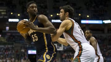 Jan 2, 2015; Milwaukee, WI, USA; Indiana Pacers center Roy Hibbert (55) looks to shoot against Milwaukee Bucks center Zaza Pachulia (27) during the third quarter at BMO Harris Bradley Center. Mandatory Credit: Jeff Hanisch-USA TODAY Sports