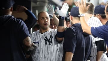 Jun 6, 2016; Bronx, NY, USA; New York Yankees right fielder Carlos Beltran (36) is congratulated in the dugout after hitting a go-ahead three-run home run against the Los Angeles Anglels during the ninth inning at Yankee Stadium. The Yankees defeated the Angels 5-2. Mandatory Credit: Brad Penner-USA TODAY Sports