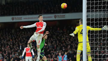 LONDON, ENGLAND - FEBRUARY 02: Laurent Koscielny of Arsenal heads the ball over Fraser Forster of Southampton during the Barclays Premier League match between Arsenal and Southampton at Emirates Stadium on February 2, 2016 in London, England. (Photo by David Price/Arsenal FC via Getty Images)