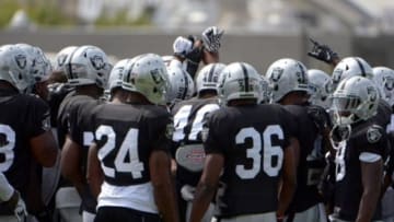 Jul 28, 2014; Napa, CA, USA; Oakland Raiders players join hands in a huddle at training camp at Napa Valley Marriott. Mandatory Credit: Kirby Lee-USA TODAY Sports