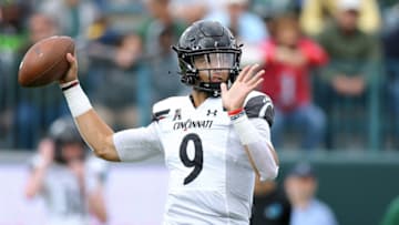 NEW ORLEANS, LOUISIANA - OCTOBER 30: Desmond Ridder #9 of the Cincinnati Bearcats throws the ball against the Tulane Green Wave during the second half at Yulman Stadium on October 30, 2021 in New Orleans, Louisiana. (Photo by Jonathan Bachman/Getty Images)