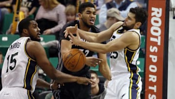 Jan 29, 2016; Salt Lake City, UT, USA; Utah Jazz forward Derrick Favors (15) and guard Raul Neto (25) battle for the rebound against Minnesota Timberwolves center Karl-Anthony Towns (32) in the third quarter at Vivint Smart Home Arena. The Utah Jazz defeated the Minnesota Timberwolves 103-90. Mandatory Credit: Jeff Swinger-USA TODAY Sports
