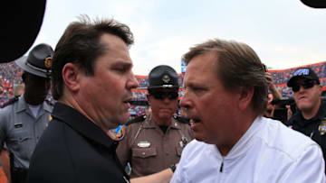 GAINESVILLE, FL - NOVEMBER 12: Head coaches Will Muschamp of the South Carolina Gamecocks and Jim McElwain of the Florida Gators shake hands after the game at Ben Hill Griffin Stadium on November 12, 2016 in Gainesville, Florida. (Photo by Rob Foldy/Getty Images)