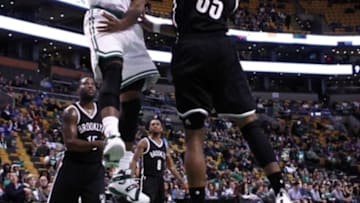 Oct 19, 2015; Boston, MA, USA; Boston Celtics forward Jordan Mickey (55) dunks the ball against Brooklyn Nets forward Justin Harper (35) during the second half at TD Garden. Mandatory Credit: Mark L. Baer-USA TODAY Sports