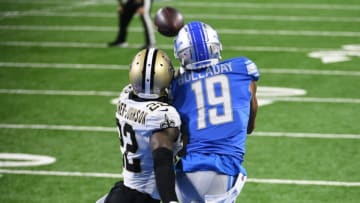 Oct 4, 2020; Detroit, Michigan, USA; Detroit Lions wide receiver Kenny Golladay (19) completes a pass for a touchdown as New Orleans Saints cornerback Marshon Lattimore (23) defends during the first quarter at Ford Field. Mandatory Credit: Tim Fuller-USA TODAY Sports