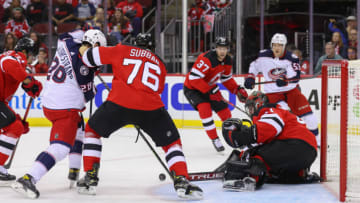 Oct 31, 2021; Newark, New Jersey, USA; Columbus Blue Jackets right wing Oliver Bjorkstrand (28) and New Jersey Devils defenseman P.K. Subban (76) battle for the puck after a save by New Jersey Devils goaltender Scott Wedgewood (41) during the first period at Prudential Center. Mandatory Credit: Ed Mulholland-USA TODAY Sports
