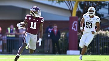 Oct 7, 2023; Starkville, Mississippi, USA; Mississippi State Bulldogs wide receiver Jaden Walley (11) runs the ball while defended by Western Michigan Broncos defensive lineman Corey Walker (93) fourth quarter at Davis Wade Stadium at Scott Field. Mandatory Credit: Matt Bush-USA TODAY Sports