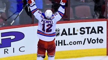 Dec 29, 2016; Glendale, AZ, USA; New York Rangers left wing Matt Puempel (12) celebrates after scoring his third goal of the game for a hat trick during the third period against the Arizona Coyotes at Gila River Arena. Mandatory Credit: Matt Kartozian-USA TODAY Sports