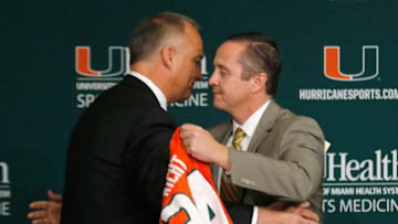 CORAL GABLES, FL - DECEMBER 04: New University of Miami Hurricanes head football coach Mark Richt, left, is introduced by UM Athletic Director Blake James a press conference at the school on December 4, 2015 in Coral Gables, Florida. (Photo by Joe Skipper/Getty Images)