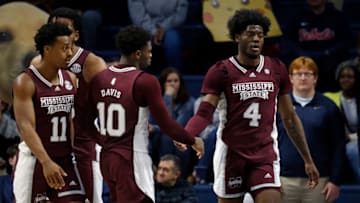 Feb 18, 2023; Oxford, Mississippi, USA; Mississippi State Bulldogs guard Dashawn Davis (10) reacts with guard/forward Cameron Matthews (4) during the second half at The Sandy and John Black Pavilion at Ole Miss. Mandatory Credit: Petre Thomas-USA TODAY Sports