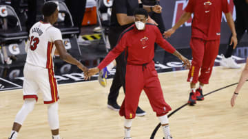 Bam Adebayo #13 of the Miami Heat high fives Udonis Haslem #40(Photo by Michael Reaves/Getty Images)