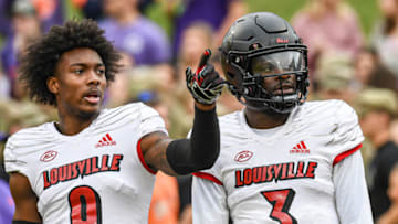 Nov 12, 2022; Clemson, South Carolina, USA; Louisville receiver Ahmari Huggins Bruce (9) and quarterback Malik Cunningham (3) talk on the field before the game with Clemson at Memorial Stadium in Clemson, South Carolina Saturday, Nov. 12, 2022. Mandatory Credit: Ken Ruinard-USA TODAY Sports