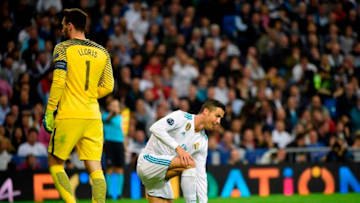 Real Madrid's Portuguese forward Cristiano Ronaldo (R) smiles next to Tottenham Hotspur's French goalkeeper Hugo Lloris during the UEFA Champions League group H football match Real Madrid CF vs Tottenham Hotspur FC at the Santiago Bernabeu stadium in Madrid on October 17, 2017. / AFP PHOTO / PIERRE-PHILIPPE MARCOU (Photo credit should read PIERRE-PHILIPPE MARCOU/AFP/Getty Images)
