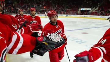 Mar 8, 2016; Raleigh, NC, USA; Carolina Hurricanes defensemen Ryan Murphy (7) celebrates a goal by forward Jeff Skinner (not shown) in the second period against the Ottawa Senators at PNC Arena. The Carolina Hurricanes defeated the Ottawa Senators 4-3. Mandatory Credit: James Guillory-USA TODAY Sports