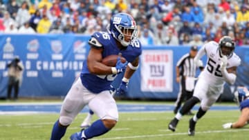 EAST RUTHERFORD, NJ - SEPTEMBER 09: Saquon Barkley #26 of the New York Giants runs with the ball in the second half against the Jacksonville Jaguars at MetLife Stadium on September 9, 2018 in East Rutherford, New Jersey. (Photo by Mike Lawrie/Getty Images)