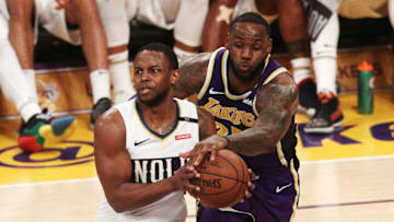 LeBron James #23 of the Los Angeles Lakers competes for the ball against Darius Miller #21 of the New Orleans Pelicans (Photo by Yong Teck Lim/Getty Images)