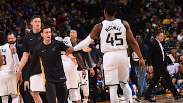 OAKLAND, CA - MARCH 25: David Stockton #5 of the Utah Jazz high fives Donovan Mitchell #45 during the game against the Golden State Warriors on March 25, 2018 at ORACLE Arena in Oakland, California. Copyright 2018 NBAE (Photo by Noah Graham/NBAE via Getty Images)