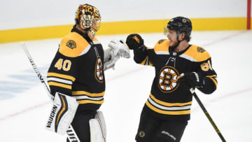 BOSTON, MA - OCTOBER 26: Tuukka Rask #40 and David Pastrnak #88 of the Boston Bruins celebrate the win against the St. Louis Blues at the TD Garden on October 26, 2019 in Boston, Massachusetts. (Photo by Steve Babineau/NHLI via Getty Images)