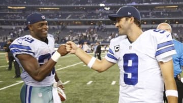 Sep 28, 2014; Arlington, TX, USA; Dallas Cowboys running back DeMarco Murray (29) celebrates with quarterback Tony Romo (9) after the game against the New Orleans Saints at AT&T Stadium. The Cowboys beat the Saints 38-17. Mandatory Credit: Matthew Emmons-USA TODAY Sports