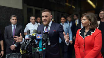 Irish mixed martial arts superstar Conor McGregor talks to the press after he pleaded guilty to a single violation of disorderly conduct, in Brooklyn Criminal Court on July 26, 2018. - The 30-year-old, who is nicknamed "The Notorious," had been charged with multiple counts of assault and criminal mischief after attacking a bus filled with UFC fighters at the Barclays Center. He pleaded guilty to a lesser charge of disorderly conduct in a fleeting court appearance, and was handed a punishment of five days' community service. (Photo by TIMOTHY A. CLARY / AFP) (Photo credit should read TIMOTHY A. CLARY/AFP/Getty Images)