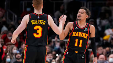 Jan 21, 2022; Atlanta, Georgia, USA; Atlanta Hawks guard Kevin Huerter (3) reacts with guard Trae Young (11) after making a three point shot against the Miami Heat during the second half at State Farm Arena. Mandatory Credit: Dale Zanine-USA TODAY Sports