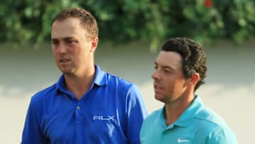 ATLANTA, GEORGIA - AUGUST 23: Justin Thomas of the United States and Rory McIlroy of Northern Ireland react on the 18th green during the second round of the TOUR Championship at East Lake Golf Club on August 23, 2019 in Atlanta, Georgia. (Photo by Streeter Lecka/Getty Images)