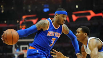 March 11, 2016; Los Angeles, CA, USA; New York Knicks forward Carmelo Anthony (7) moves the ball against Los Angeles Clippers forward Wesley Johnson (33) during the first half at Staples Center. Mandatory Credit: Gary A. Vasquez-USA TODAY Sports