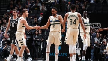 BROOKLYN, NY - FEBRUARY 4: Giannis Antetokounmpo #34, Matthew Dellavedova #8, and Jabari Parker #12 of the Milwaukee Bucks high five against the Brooklyn Nets on February 4, 2018 at Barclays Center in Brooklyn, New York. NOTE TO USER: User expressly acknowledges and agrees that, by downloading and/or using this photograph, user is consenting to the terms and conditions of the Getty Images License Agreement. Mandatory Copyright Notice: Copyright 2018 NBAE (Photo by Nathaniel S. Butler/NBAE via Getty Images)