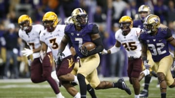 Nov 19, 2016; Seattle, WA, USA; Washington Huskies linebacker Keishawn Bierria (7) races down the field for a 45-yard kick off return for a touchdown against the Arizona State Sun Devils after a failed onside kick attempt during the fourth quarter at Husky Stadium. Washington won 44-18. Mandatory Credit: Jennifer Buchanan-USA TODAY Sports