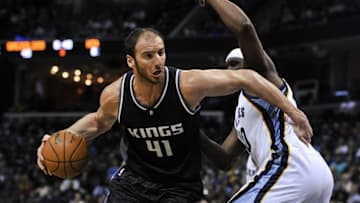 Dec 16, 2016; Memphis, TN, USA; Sacramento Kings center Kosta Koufos (41) handles the ball against Memphis Grizzlies forward Zach Randolph (50) during the second half at FedExForum. Sacramento Kings defeated the against the Memphis Grizzlies 96-92. Mandatory Credit: Justin Ford-USA TODAY Sports