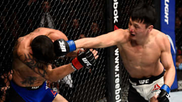 TORONTO, CANADA - DECEMBER 10: (R-L) Dooho Choi of South Korea punches Cub Swanson in their featherweight bout during the UFC 206 event inside the Air Canada Centre on December 10, 2016 in Toronto, Ontario, Canada. (Photo by Jeff Bottari/Zuffa LLC/Zuffa LLC via Getty Images)