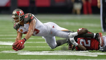 Sep 11, 2016; Atlanta, GA, USA; Tampa Bay Buccaneers wide receiver Vincent Jackson (83) reaches for extra yardage as he is tackled by Atlanta Falcons cornerback Desmond Trufant (21) during the first half at the Georgia Dome. The Buccaneers won 31-24. Mandatory Credit: Dale Zanine-USA TODAY Sports