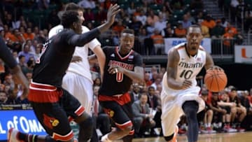 Feb 3, 2015; Coral Gables, FL, USA; Miami Hurricanes guard Sheldon McClellan (10) dribbles the ball past Louisville Cardinals guard Terry Rozier (0) during the second half at BankUnited Center. Mandatory Credit: Steve Mitchell-USA TODAY Sports