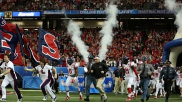 Dec 31, 2014; Atlanta , GA, USA; Mississippi Rebels and head coach Hugh Freeze take the field prior to facing the TCU Horned Frogs in the 2014 Peach Bowl at the Georgia Dome. Mandatory Credit: Kevin Liles/CFA Peach Bowl via USA TODAY Sports