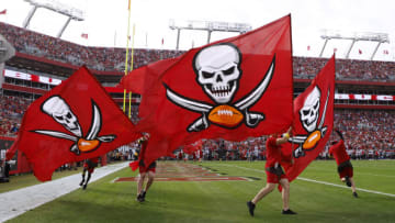 TAMPA, FLORIDA - JANUARY 01: Flags are run in the end zone to celebrate a Tampa Bay Buccaneers touchdown during the fourth quarter against the Carolina Panthers at Raymond James Stadium on January 01, 2023 in Tampa, Florida. (Photo by Mike Ehrmann/Getty Images)