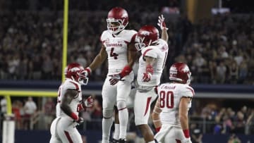 Sep 24, 2016; Dallas, TX, USA; Arkansas Razorbacks wide receiver Keon Hatcher (4) celebrates a touchdown with wide receiver Jared Cornelius (1) in the first quarter against the Texas A&M Aggies at AT&T Stadium. Mandatory Credit: Tim Heitman-USA TODAY Sports