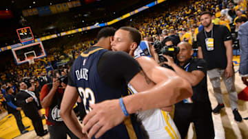 OAKLAND, CA - MAY 8: Anthony Davis #23 of the New Orleans Pelicans and Stephen Curry #30 of the Golden State Warriors hug after Game Five of the Western Conference Semifinals during the 2018 NBA Playoffs on May 8, 2018 at ORACLE Arena in Oakland, California. NOTE TO USER: User expressly acknowledges and agrees that, by downloading and/or using this photograph, user is consenting to the terms and conditions of Getty Images License Agreement. Mandatory Copyright Notice: Copyright 2018 NBAE (Photo by Noah Graham/NBAE via Getty Images)