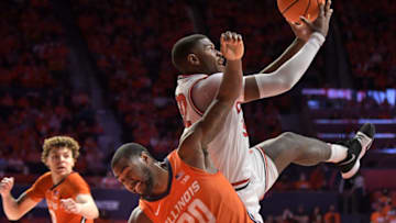 Feb 24, 2022; Champaign, Illinois, USA; Ohio State Buckeyes forward E.J. Liddell (32) grabs a rebound over Illinois Fighting Illini guard Da'Monte Williams (20) during the second half at State Farm Center. Mandatory Credit: Ron Johnson-USA TODAY Sports