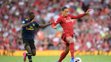 LIVERPOOL, ENGLAND - AUGUST 24: Virgil van Dijk of Liverpool controls the ball during the Premier League match between Liverpool FC and Arsenal FC at Anfield on August 24, 2019 in Liverpool, United Kingdom. (Photo by Laurence Griffiths/Getty Images)